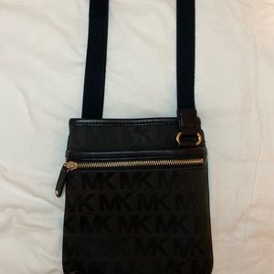Michael Kors black logo embossed crossbody bag